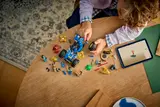 Child building with digital instructions.