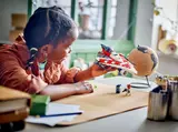 Child playing with A-wing.