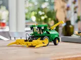 LEGO Technic John Deere harvester on table.