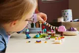 Adjusting LEGO party banner.