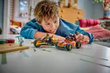 Boy admiring his built LEGO Ninjago vehicles.