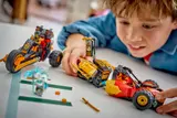 Child combining the Ninjago vehicles.