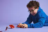 Child playing with spinner set.