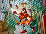 Mech climbing a wire shelf.