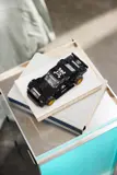 LEGO Hoonicorn displayed on books.
