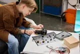 Person building LEGO Hoonicorn.
