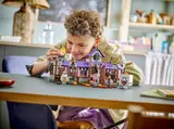 Kid playing with mansion.