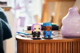 Kingsley and Tonks BrickHeadz on a table.
