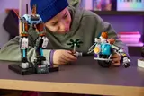 Mech and motorcycle together on desk.