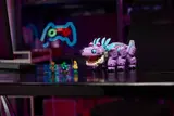 Klombo on a gaming desk.