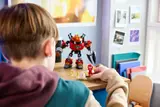 Child playing with the LEGO set.