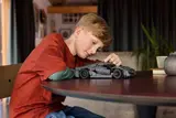 Boy playing with Technic Jesko Absolut