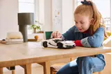 Child playing with Technic Jesko.
