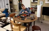 Builder assembling Sadair model.