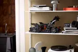 Sadair model with open doors on shelf.