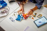 Overhead view of LEGO Mbappé set being built with digital instructions.