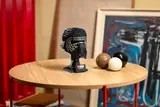 Kylo Ren Helmet on table.