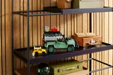 Small and large LEGO Defenders on a shelf.