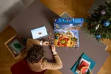 Aerial view of child building with LEGO Advent Calendar.