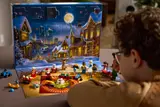 Child playing with LEGO City Advent Calendar 2025.