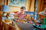 Happy child with LEGO mini-build.