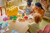 Family building LEGO together.