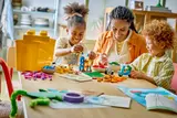 Kids focused on LEGO building.