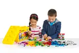 Kids building with LEGO.