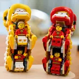 Minifigures inside LEGO lion dancers.