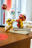 LEGO lion dancers in vertical pose.
