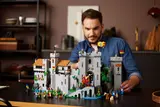 Person with the LEGO Lion Knights' Castle.