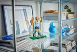 LEGO Messi figure on a shelf.