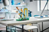 LEGO Messi figure on a desk.