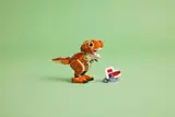 Side view of LEGO T. rex on green background.