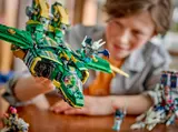 Child inspecting Ninjago jet.