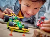 Child playing with LEGO race car.
