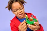Kid holding Ninjago spinners