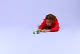 Boy playing with Ninjago set