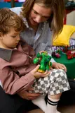 Child holding She-Hulk mech.