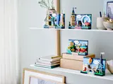LEGO Postcard collection on shelves.