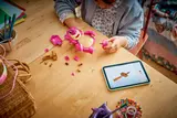 Building Lotso with tablet.