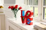 LEGO LOVE sculpture on windowsill.