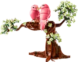 Pink love birds on a tree.