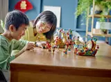 Child and adult playing with LEGO parade set.