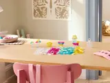 Table with transparent LEGO builds.