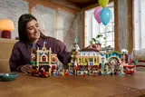 Person interacting with LEGO set.