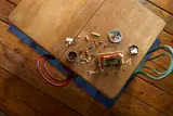 LEGO bricks and partial build on table.