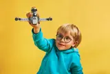 Child playing with N-1 Starfighter.