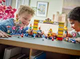 Kids playing with Mario Kart LEGO.
