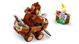 Donkey Kong in kart throwing a red shell at a banana target.